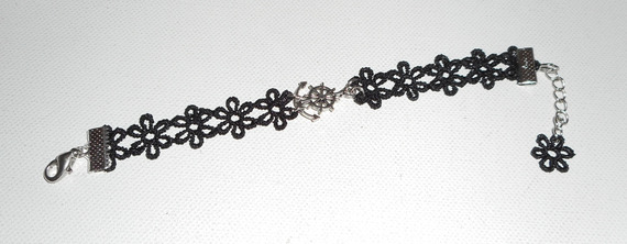 Originalarmband med ankare och roder på svart spets.
