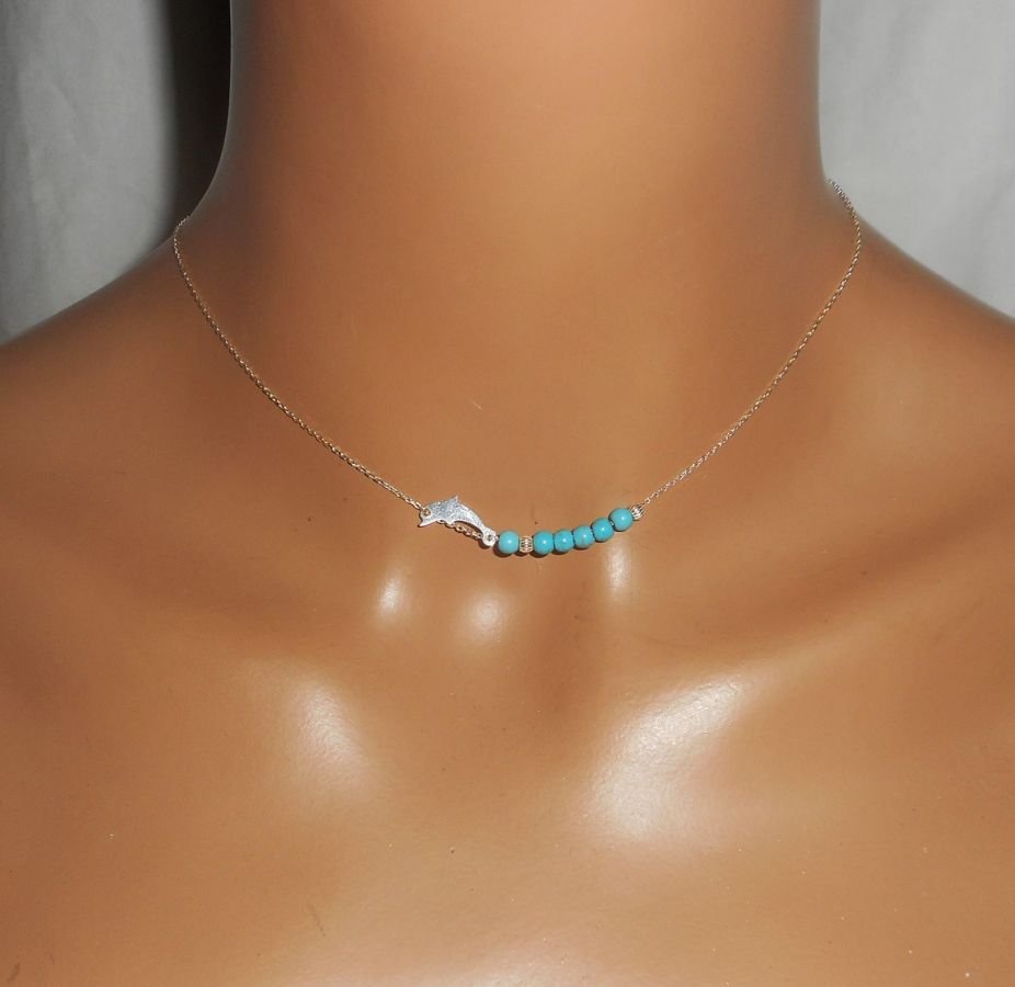 Halsband i 925 silver med liten delfin och turkosa stenar